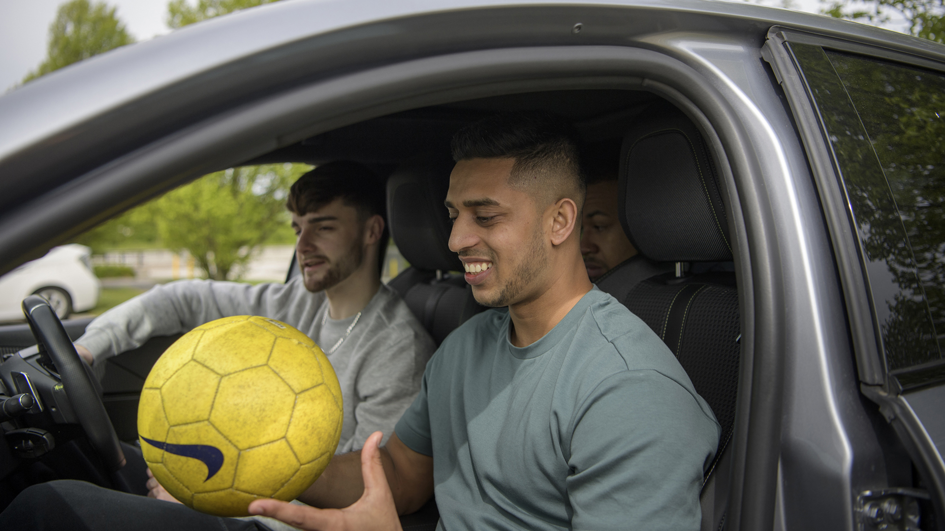 Two young men sitting in a car
