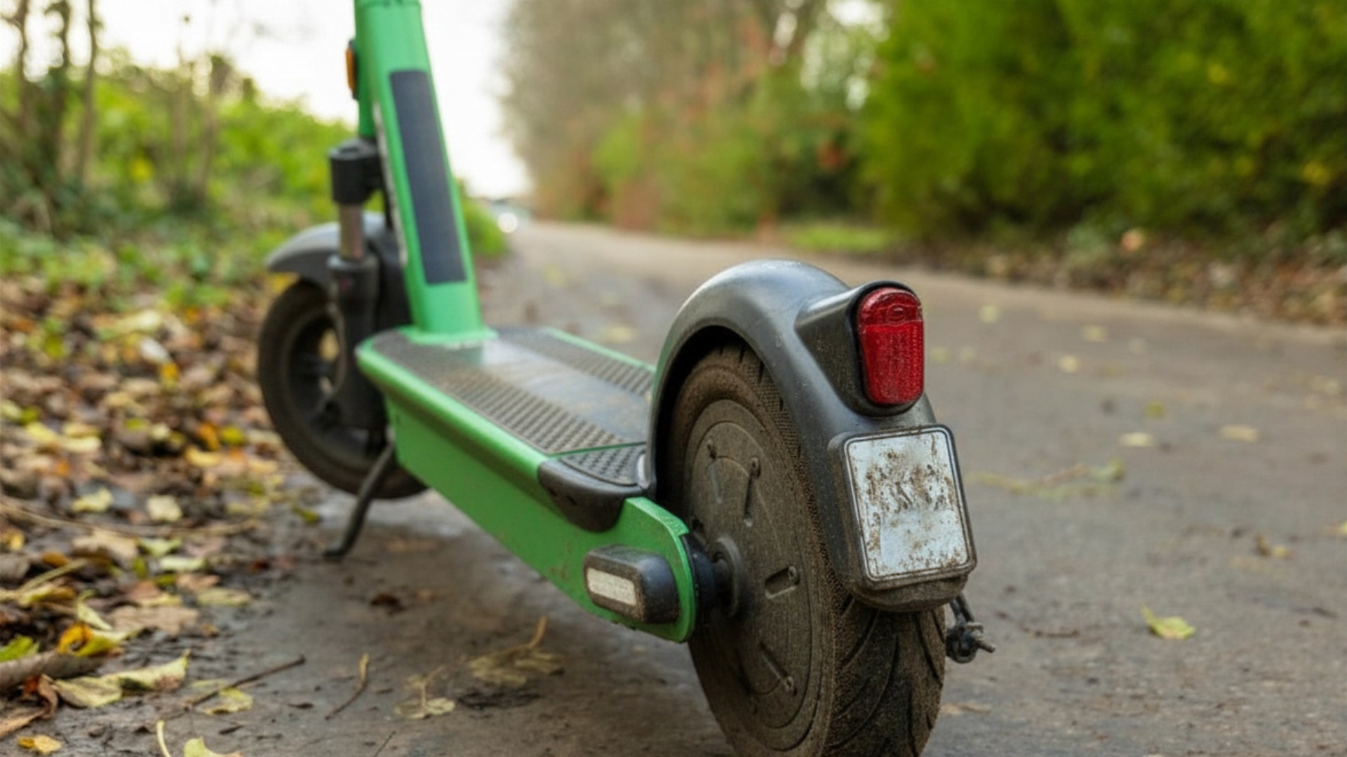 electric scooter vehicle left on pedestrian footpath.jpg